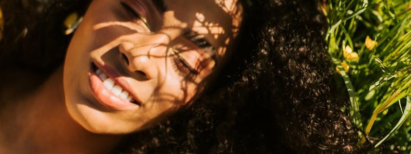 Person resting in a final relaxation pose on a mat.